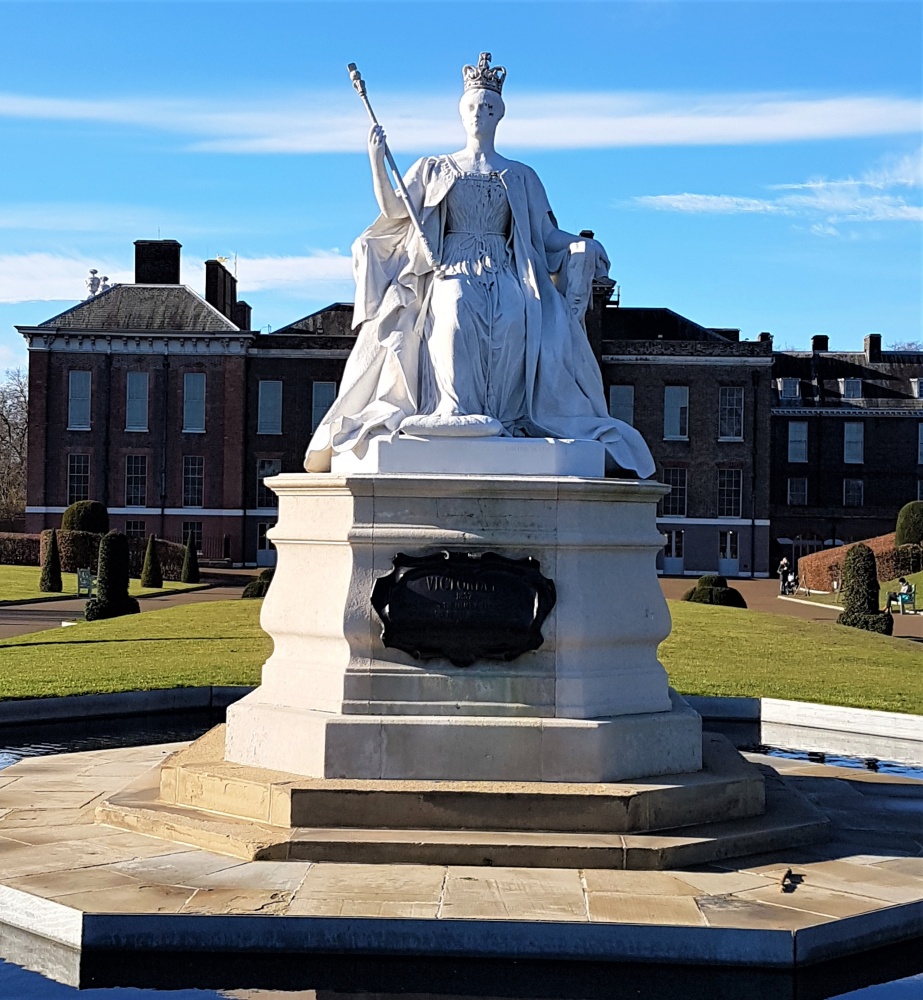 White marble statue of Queen Victoria outside Kensington Palace in London