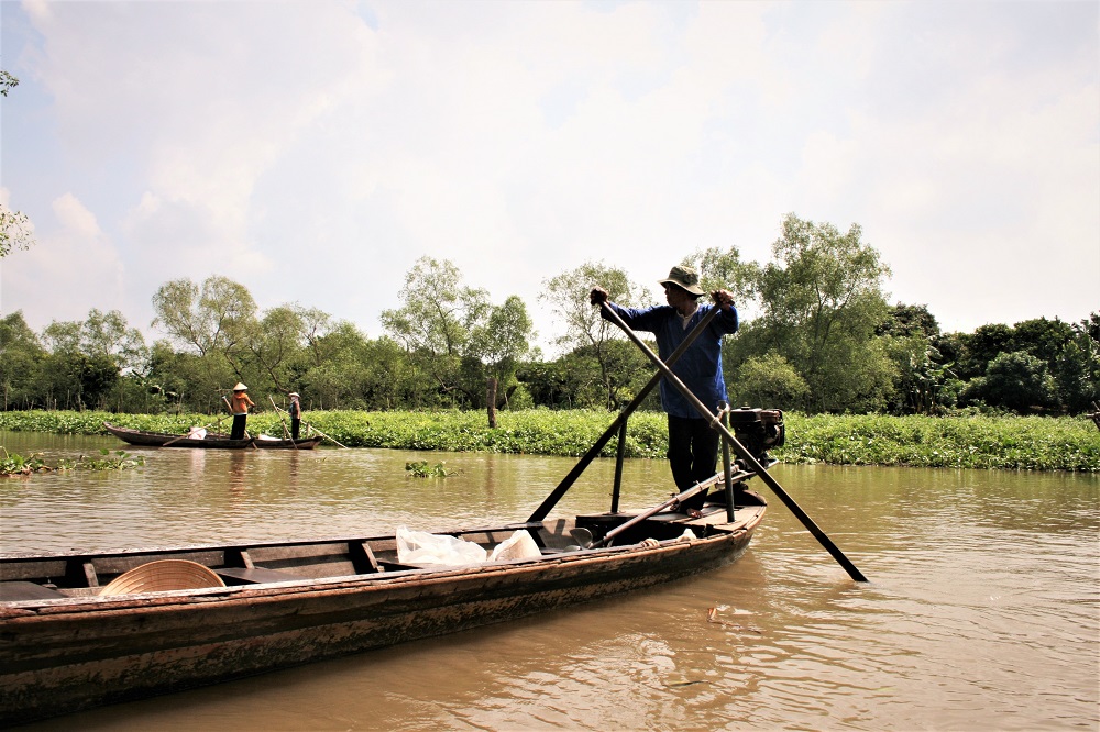 Man on a boat in the Mekong Delta