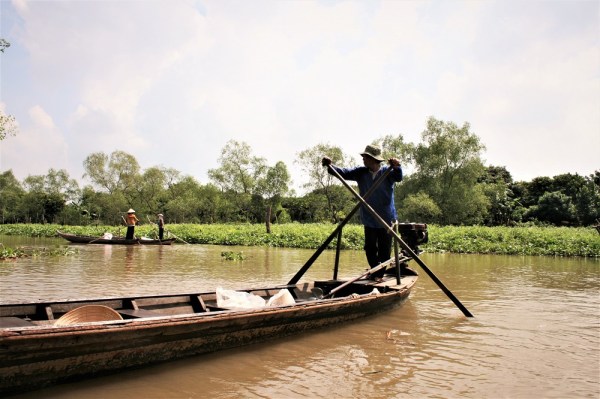 Man on a boat in the Mekong Delta