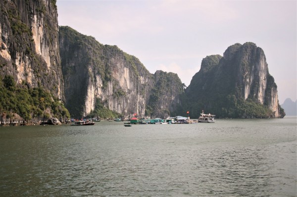 A floating village beneath the limestone rocks in Halong Bay