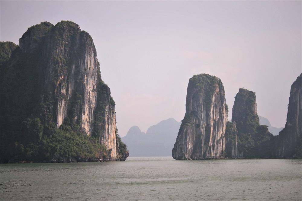 Limestone rocks jut out of the water in Halong Bay