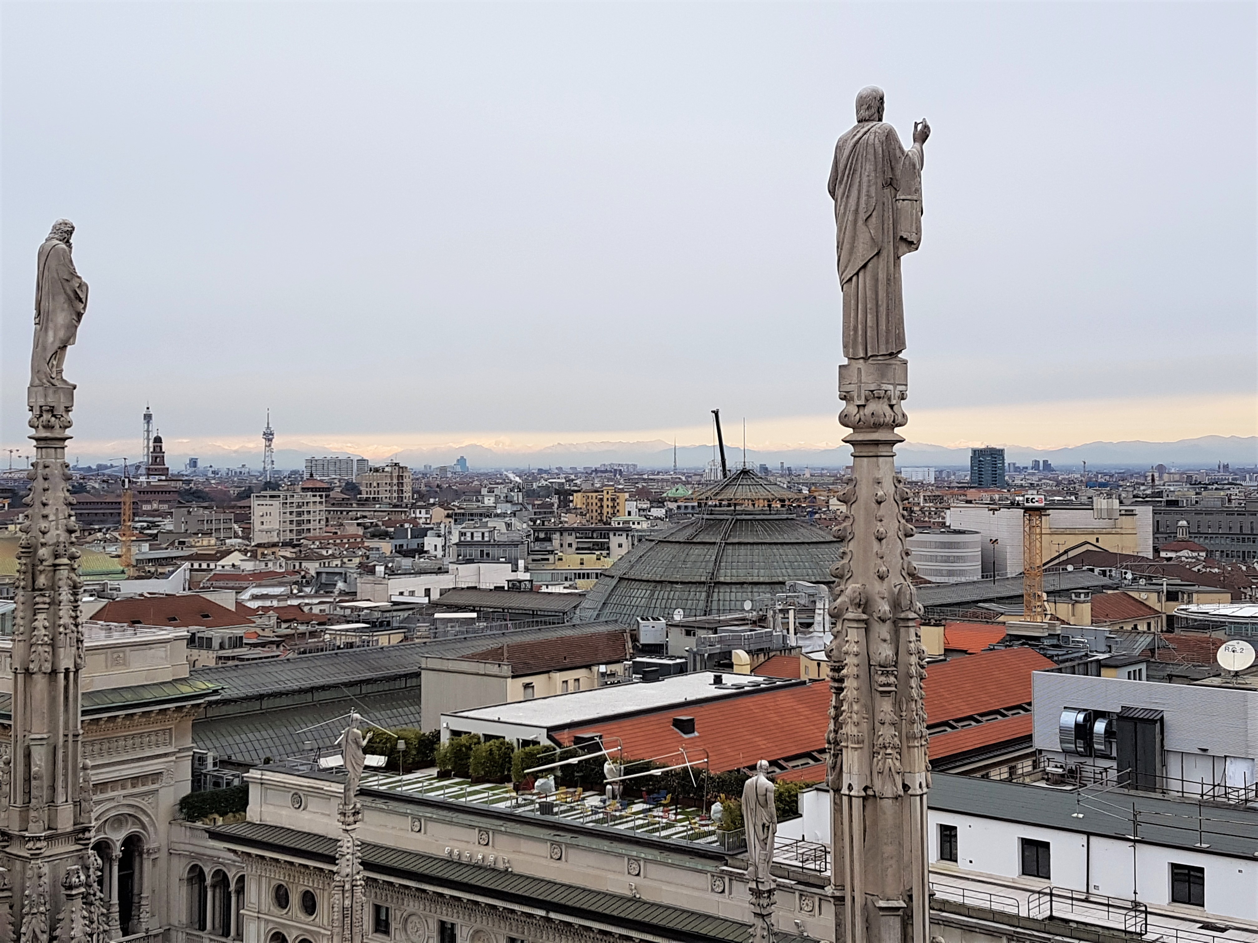 View from the roof terrace across Milan and the Alps
