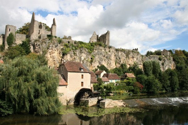 View of the cliff-top fortress and a mill in Angles-sur-l'Anglin from the River Anglin