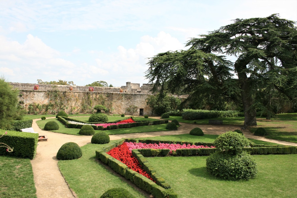 Red and pink flowers in the gardens of the Chateau de Montreuil-Bellay