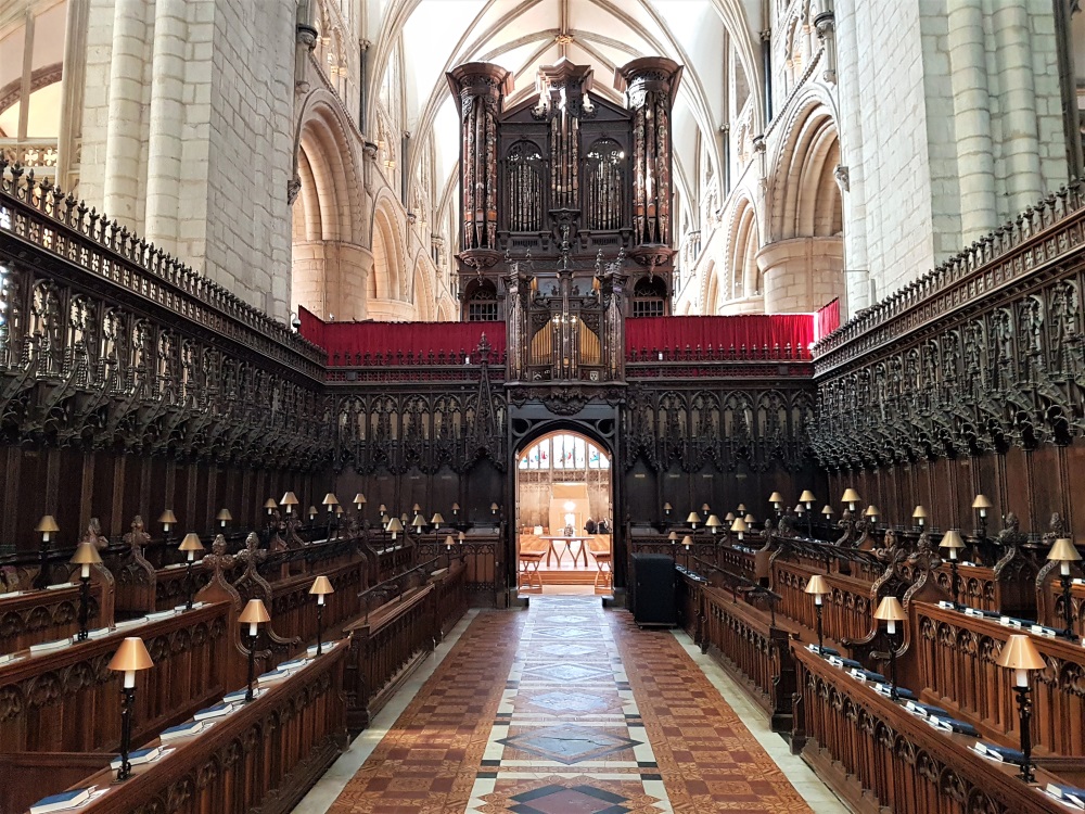 The wooden choir stalls inside Gloucester Cathedral