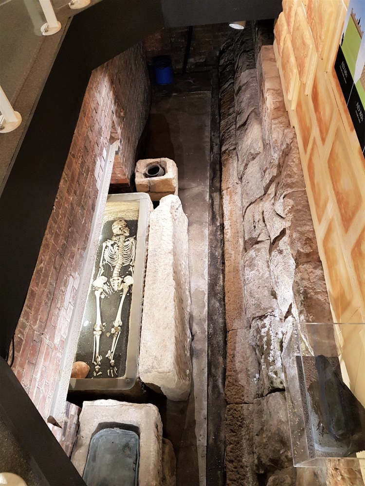 Roman walls and skeleton on display at the Museum of Gloucester