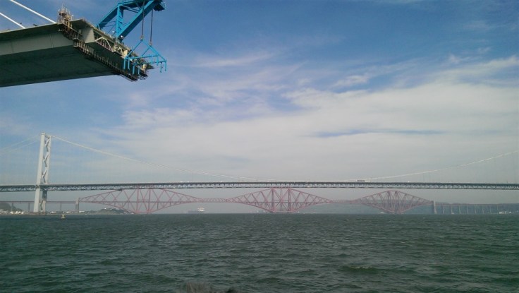 The partially constructed new Forth Bridge with the other two bridges in the background