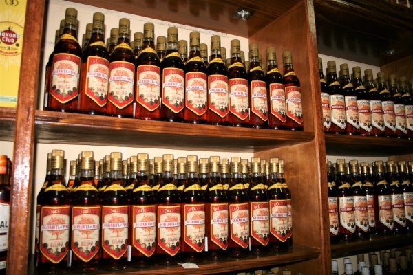 Shelves full of bottles of guayabita flavoured rum liqueur for sale in Pinar del Rio, Cuba