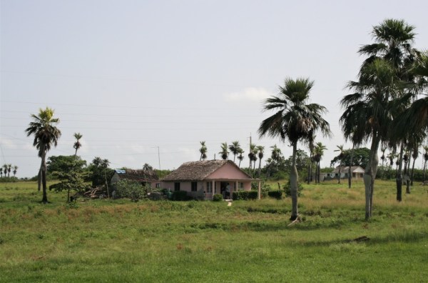 A pink house in a field in Cuba