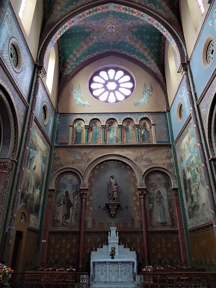 A pretty painted altar inside the Eglise Notre Dame in Oloron-Sainte-Marie