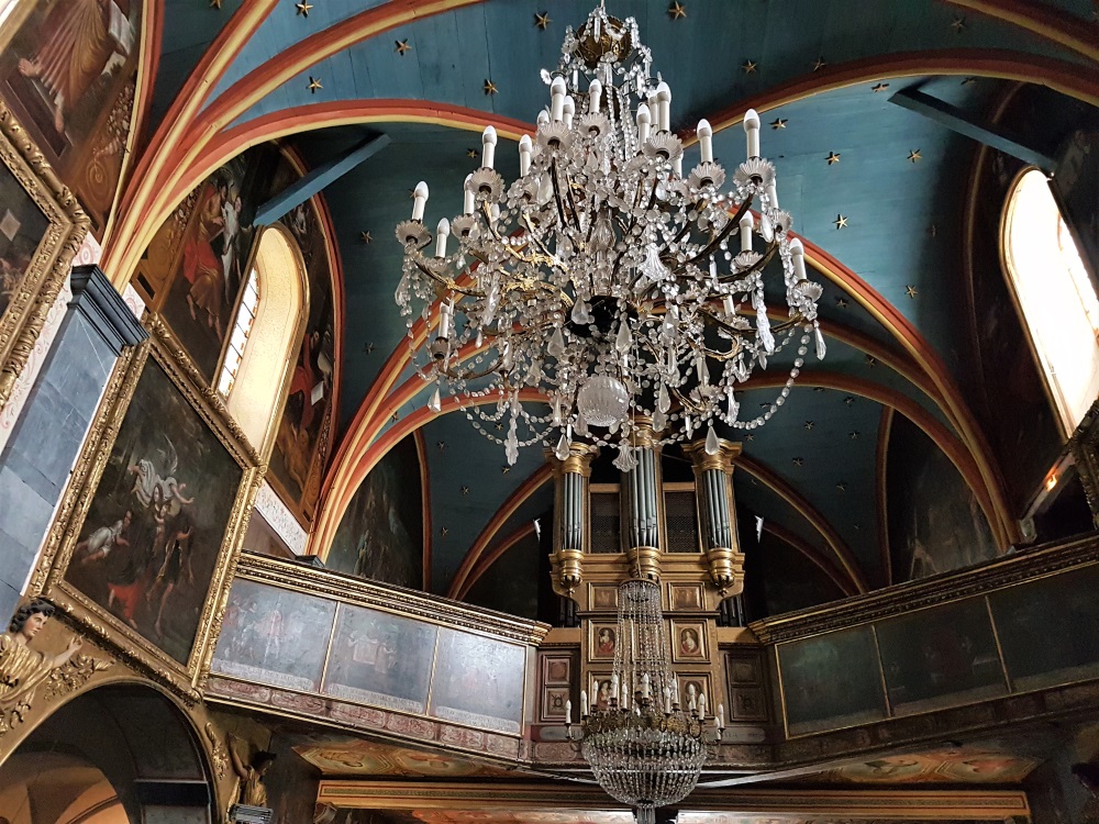 The opulent chandeliers inside the Chapelle Notre-Dame de Betharram