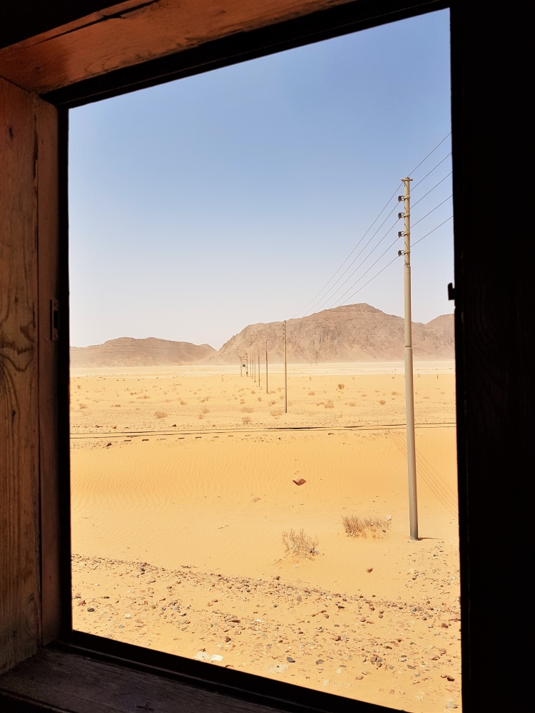View from inside the Al Hijaz Steam train at Wadi Rum Station