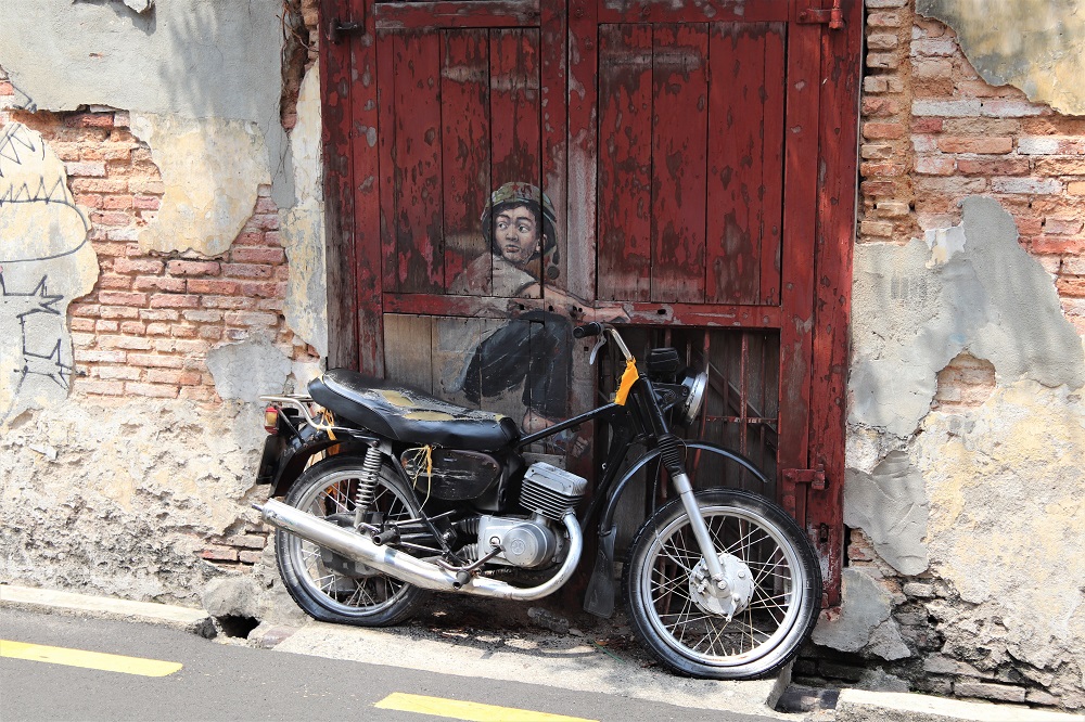 Boy on a motorcycle, one of the many incredible pieces of street art in Georgetown, Penang