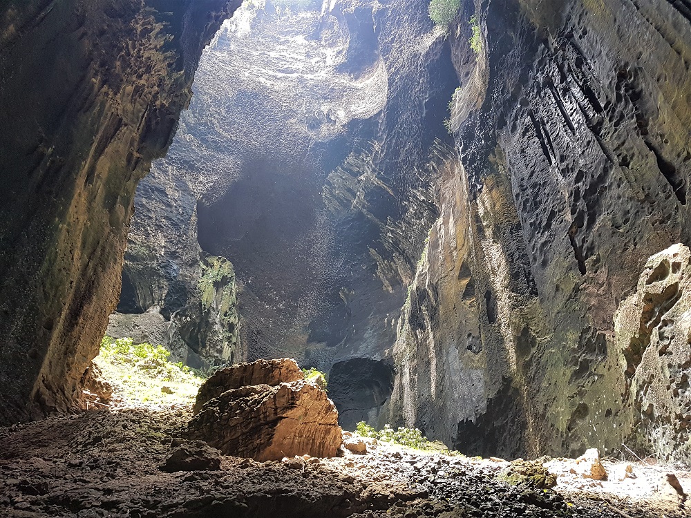 Light shines inside the Gomantong Caves in Borneo