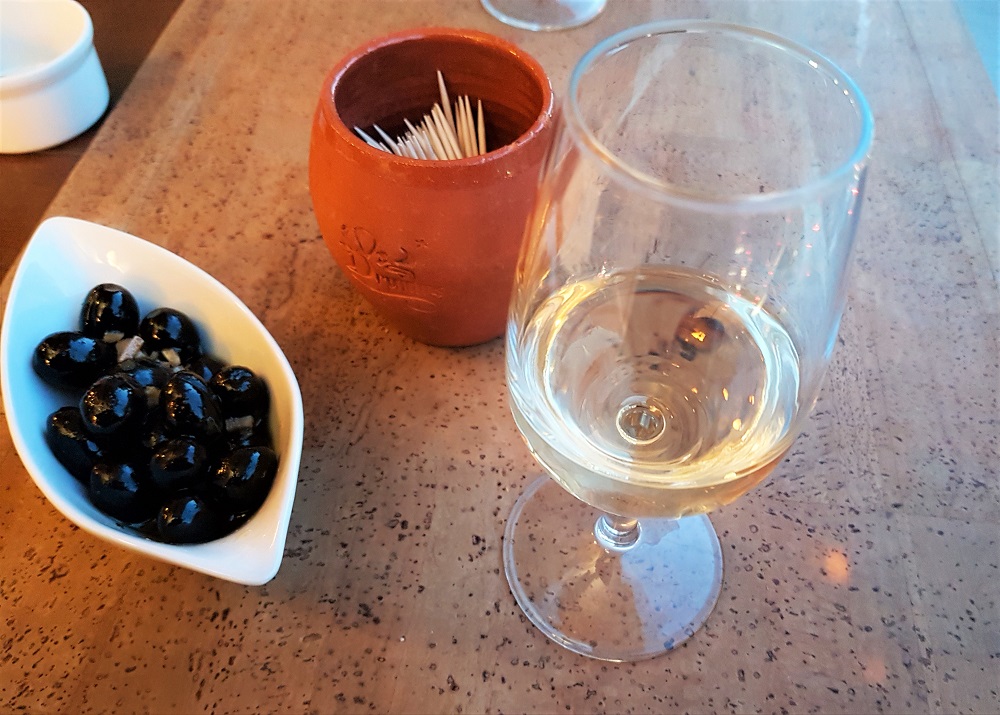 A pre-dinner glass of port and some olives at Linha22 in Porto