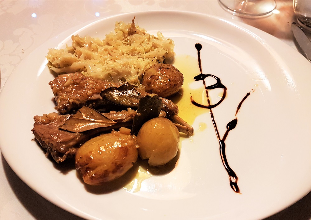 Wild boar cutlets with boiled cabbage and roasted new potatoes in a special sauce at eLeBe Baixo in Porto