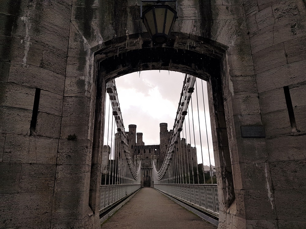 Entrance to the Conwy Suspension Bridge, with Conwy Castle in the background