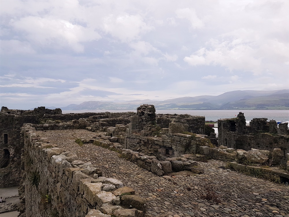 View from the top of the ramparts at Beaumaris Castle, looking out towards Gwynedd and the Menai Strait